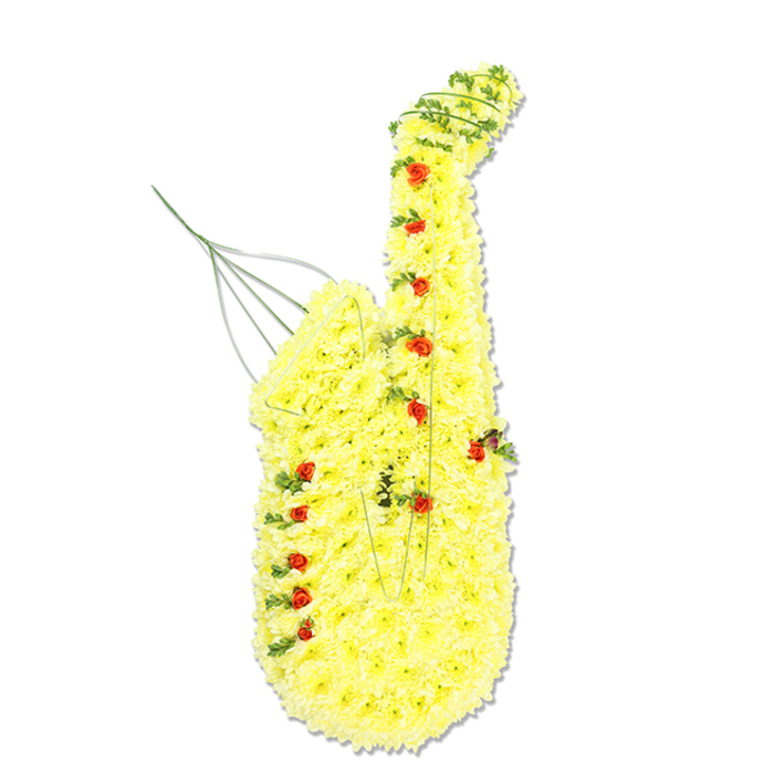 A detailed floral sculpture in the unmistakable shape of a saxophone is presented against a smooth white background, giving it the look of a carefully lit studio portrait. The saxophone's body is completely enrobed in compact, bright yellow chrysanthemum florets, each bloom nestled closely against its neighbours so that the surface appears seamless and plush. This yellow tapestry follows the slim line of the mouthpiece, flows into the gently bending neck, then widens into the rounded bell at the base, capturing the elegant curves of the instrument. Punctuating this sea of yellow are numerous small, deep red rosebuds, thoughtfully spaced where the saxophone's keys and buttons would naturally be positioned, their rich colour and rounded shapes providing both contrast and a sense of musical structure. Fine strands of lush green trailing foliage are artfully entwined along the edges and through sections of the body, especially at the neck and lower sweep, where they help define the outline while suggesting the movement of sound or breath moving through the instrument. Barely visible near the upper left, in the region of the mouthpiece, slender green or metallic wires extend slightly upwards, hinting at the internal supports that keep the tribute tall and true. The even white lighting highlights the clarity of the yellow, red, and green palette, making the design feel bright yet respectful. This floral saxophone would be a meaningful centrepiece at a memorial in Stanmore, perhaps in one of the local synagogues or churches, paying homage to a life marked by music, whether through jazz performances, band concerts at local schools, or cherished family gatherings where songs were always playing.