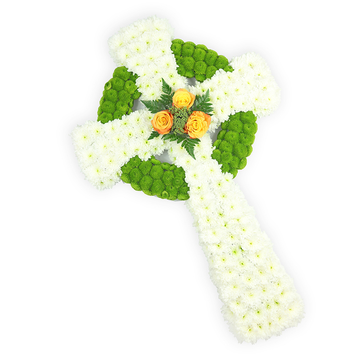 This image presents a meticulously crafted floral Celtic cross, captured on a clean white field and viewed slightly from above so the arrangement's depth and detail are clear. The cross is predominantly composed of compact clusters of white spray chrysanthemums whose small, layered petals form a smooth, cloud-like surface that conveys dignity and grace. Bright lime-green button chrysanthemums are interspersed in deliberate sections to carve out the circular centre ring and to alternate through the horizontal arms, their dense, globe-like heads providing fresh colour and tactile contrast against the white. Anchoring the design at the meeting point of the arms are three warm orange-yellow roses, their petals tightly petalled yet opening to suggest a gentle radiance; these roses are framed by short sprigs of darker green foliage that add shadowed depth and a botanical outline. The lighting is soft and neutral, revealing petal texture and the arrangement's three-dimensional silhouette without casting distracting shadows. The white, green, and orange palette echoes Irish colours and lends this piece cultural resonance-an appropriate choice for commemorations that honour Celtic heritage or St. Patrick's connections-while remaining solemn enough for a funeral or memorial service in Stanmore Hill, near Stanmore Station, or at local churches. The scent would be a muted mix of chrysanthemum freshness and a faint rose perfume in person, and the piece demonstrates considered technique: tight massing, balanced colour placement, and an overall restraint that reads as both reverent and heartfelt.