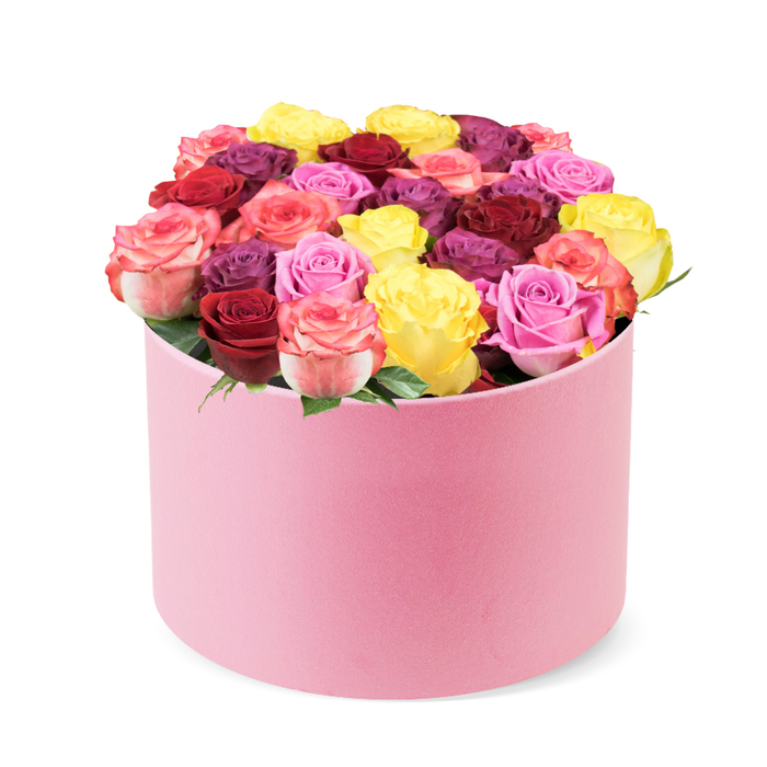 An elegant rose box in a pale pink hat box sits against a clean white backdrop, the cylindrical container's soft velvet-like finish catching a gentle light. The lid curves with a subtle grace, revealing a dense display of thirty to forty roses that spill in a lush dome over the rim. The blooms present a spectrum: sunshine yellow, deep red, burgundy, soft pinks from blush to magenta, cream-toned petals, and regal purple-plum hues. Each rose is fully bloomed, petals arranged in tight spirals, exuding premium freshness. A few bright green leaves peek between petals, adding a natural contrast that emphasizes the vitality of the bouquet. The arrangement feels luxurious and refined, a perfect gift for Valentine's Day, anniversaries, or Mother's Day, and a striking addition to stylish home decor. It hints at high-end delivery service, with careful packaging and a sense of refined taste, suitable for gifting to someone who appreciates colour harmony and craftsmanship. In Stanmore, this exquisite box would be delivered to homes near Stanmore Station or along The Ridgeway and The High Street, offering same-day delivery to the local community. The soft pink tone pairs with the dramatic palette to create a bouquet that can brighten a room or accompany a small celebration. The composition suggests both romance and celebration; it would be equally at home as a thoughtful birthday surprise or a heartfelt gesture of appreciation. The box's luxurious texture and the bouquet's generous scale speak to the skill and care of a local florist who understands the language of colour and form.