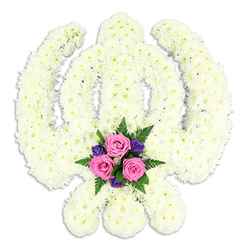 Set against a pure white background, a large Khanda floral tribute takes centre stage, its form instantly recognisable as the revered emblem of Sikhism. The entire symbol-the vertical double-edged sword, the surrounding chakkar, and the outward-curving kirpans-is rendered in a continuous expanse of white chrysanthemum blooms. Each flower is snugly nestled against its neighbours, so the surface looks like a soft, snowy tapestry, with just the gentle rippling of individual petals breaking the uniformity. This texture, combined with the clean white surroundings, gives the tribute a serene, contemplative atmosphere, similar to standing in a quiet, sunlit corner of a Stanmore gurdwara before a service begins. At the lower centre, where the swords cross, a thoughtfully composed cluster of brighter blooms adds warmth and human feeling. Three pink roses sit close together, their petals unfurling in tight, romantic spirals, surrounded by smaller, intense purple flowers that lend depth and contrast. Sprigs of rich green foliage and feathery ferns peek between the blooms, breaking up the white and drawing the eye to this focal point. The lighting is soft yet clear, throwing a delicate shadow beneath the Khanda and giving it a sculpted, dimensional look, as though it has just been placed on a display stand before leaving for a funeral in Stanmore or nearby Edgware. This floral piece is designed as a meaningful Sikh funeral or memorial tribute, honouring a loved one's life and faith with a combination of symbolic form and carefully chosen colours that speak of love, respect, and lasting connection.