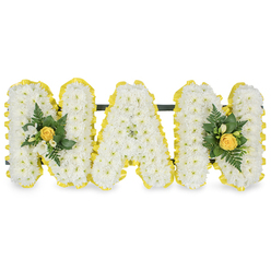 A tender floral tribute composed to honour a cherished grandmother, the arrangement spells out the letters MAM in three freestanding capitals, each densely covered in small, immaculate white chrysanthemum sprays that create a soft, cloud-like surface. The composition is edged all the way round with a bright, pleated yellow satin ribbon, its sunny tone crisply framing each letter and catching the light like a warm ribbon of memory. At the leftmost 'M' and the rightmost 'M' delicate accent clusters are placed with intent: a centrally furled yellow rosebud anchors each cluster, surrounded by fragrant white freesia or similar tiny white buds and a selection of deep green, glossy leaves and slender fern fronds that lend texture and a verdant freshness. A discreet dark green or black horizontal rail runs behind the upper portions of the letters, unseen from the front but providing secure support for display on a chapel stand, grave easel or service table. In soft daylight the chrysanthemums' immaculate whites and the ribbon's vivid yellow read as a quiet conversation between purity and warmth; the freesia and rose add a gentle perfume that feels familiar and comforting. As a Stanmore florist I think of arranging this for families gathering near Stanmore Hill, Bentley Priory or Marsh Lane, where its understated elegance and comforting tones help tell stories of gentle laughter and afternoons shared. Flowers Stanmore can prepare and deliver this personalised sympathy design locally with a careful, respectful hand.