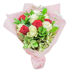 This bouquet encapsulates the fine artistry of a Stanmore florist, where brilliant white roses glow like luminous orbs, set amidst rich ruby-red blooms that capture the vibrancy of life on The Broadway. Generous layers of glossy, variegated foliage and aromatic eucalyptus envelop the central roses, introducing both depth and a sense of living movement to the piece. The bouquet nestles within blush-pink wrapping that reflects a subtle light, reminiscent of an early evening stroll through Stanmore Country Park. Touches of pale cream and gentle green accentuate the arrangement, evoking the freshness of an English garden and grounding the passionate reds and tranquil whites. Whether gifted for a birthday, milestone celebration, or simply as a spontaneous gesture, this bouquet-and the care invested in every stem-brings an atmosphere of refined tenderness and joyful energy. It's a celebration of both classic floristry and the welcoming, community spirit of Stanmore, offering a hint of lasting spring with every glance.