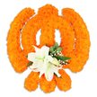 A reverent, hand-crafted floral Khanda sits against a pristine white background, its iconic form entirely composed of hundreds of densely packed bright orange marigold blossoms. From a florist's viewpoint the piece reads as both sculpture and offering: the warm, velvety marigold heads are arranged to clearly define the chakkar (circular disc) at the center, the two crossed kirpans behind it, and the smaller upright double-edged khanda blade in the middle, each element catching soft studio light so the surface reads with gentle highlights and shadowed depth. Nestled where the kirpans meet, a cluster of large white lilies-at least two fully open-offers a serene counterpoint; their unfurling petals reveal delicate green-and-yellow stamens and add cool, elegant lines against the orange texture. Small sprays of baby's breath and lush green foliage, likely salal leaves, tuck into the composition, softening edges and giving the emblem a living freshness and subtle scent of citrus and white florals. A faint drop shadow beneath suggests the piece is a freestanding tribute suited for placement on a shrine table or near the entrance of a local gurdwara. The overall effect is one of devotion and celebration: the bright marigolds signal festivity while the lilies read as purity and calm, together communicating the spiritual gravity of Sikh festivals such as Vaisakhi or Gurpurab. As a Stanmore floral offering, this arrangement would speak gently to community gatherings in Canons Park or to quiet tributes placed along Stanmore Broadway, blending traditional materials with considered floral craftsmanship.