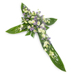 A solemn, handcrafted floral cross photographed from a gentle overhead angle against a pristine white background, the composition designed to read clearly and quietly from a distance. The structural base is built from broad, glossy tropical leaves-think Ti or similar waxy foliage-laid flat so their deep green tones and visible veins form the defined arms and central shaft of the Christian cross. At the crossing and tracing each arm, clusters of soft white and creamy ivory blooms are arranged densely: ruffled lisianthus with their layered, papery petals and tight buds sit beside small, rounded white chrysanthemums that bring a bright, comforting clarity. Scattered among these are sprays of tiny, star-like lavender or pale purple flowers, likely limonium or small asters, which offer a cool, tranquil punctuation against the warm whites and greens. Fine green filler foliage is woven subtly through the floral masses, adding delicate texture and an organic, natural edge to the otherwise formal silhouette. Lighting is even and soft, lifting the creamy highlights on petals and the gentle sheen on the leaves to create a calm, almost spiritual radiance. The impression is one of respectful restraint-a sympathy piece intended for memorial services, church vigils, or graveside placement-conveying peace, remembrance, and quiet dignity. A faint green, leafy scent seems implied by the imagery, suggesting freshness and the slow, comforting breath of a summer morning. For families in Stanmore seeking a dignified tribute - whether near Canons Park or by Stanmore High Street chapels - this cross reads as a tender, reverent expression of condolence and enduring hope.