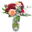 Immediately engaging with its blend of deep, velvety reds and soft peachy tones, this bouquet reflects the subtle artistry found throughout Stanmore's floral shops. The centrepiece features a trio of peaches-and-cream roses, their petals layered in gentle spirals that give a sense of unfolding warmth and romance, much like the welcoming homes along Uxbridge Road. Framing these are burgundy chrysanthemums, whose ruffled petals add sumptuous texture and visual intrigue, recalling richly appointed gardens around Stanmore Park. Wisps of baby's breath drift through, their dainty white blossoms offering a light, celebratory contrast. Glossy, vibrant leaves and aromatic sprigs of eucalyptus provide structure, freshness, and a calming scent reminiscent of a morning stroll on the Common. Thoughtfully arranged in a clear glass vase, the entwined stems are visible in all their natural grace, lending authenticity and charm. This bouquet is perfect for expressing sincere affection, celebrating a special occasion, or simply bringing a note of thoughtful elegance to a neighbour or friend in Stanmore-with a wink to the artistry and dedication of local florists.